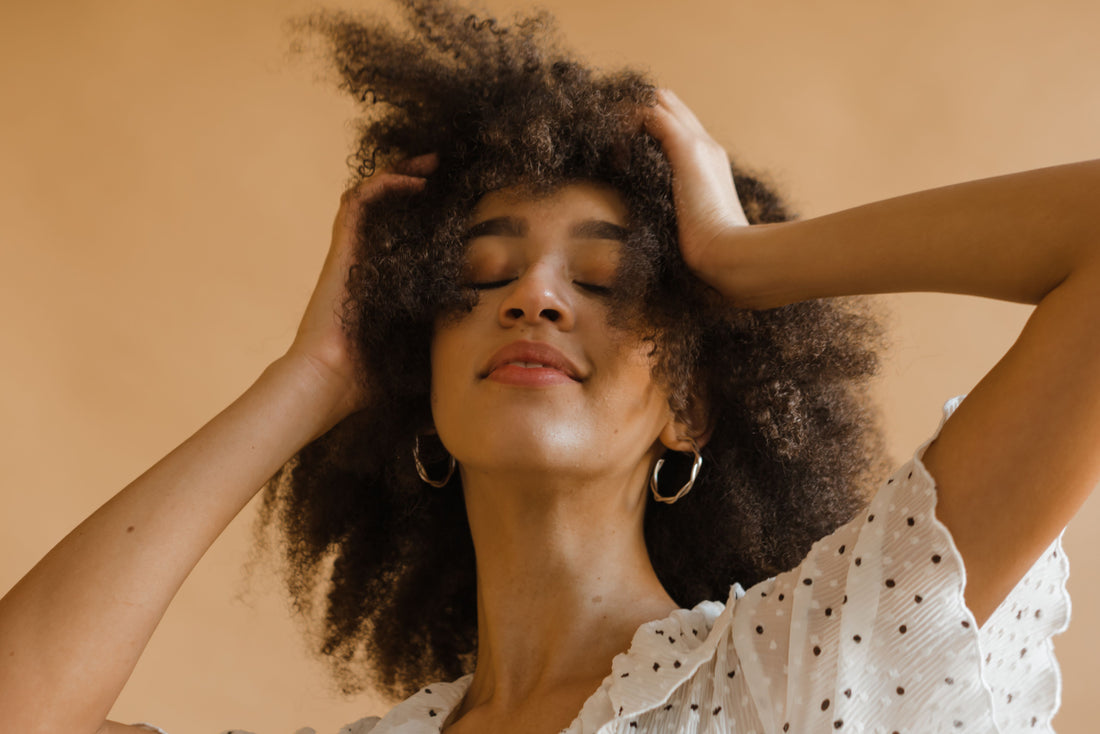  A woman with healthy 4C natural hair after a protein treatment.