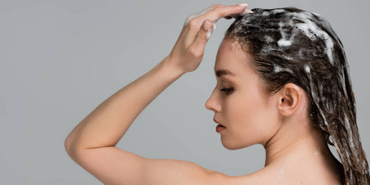 woman shampooing her hair